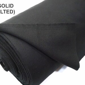 May include: A roll of black solid fabric, not quilted.