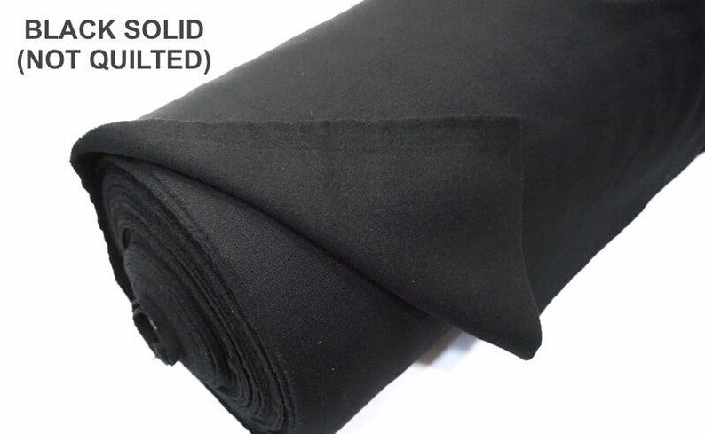 May include: A roll of black solid fabric, not quilted.