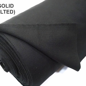May include: A roll of black solid fabric, not quilted.