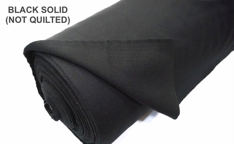 May include: A roll of black solid fabric, not quilted.