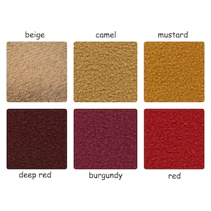 May include: Six fabric swatches in different colors: beige, camel, mustard, deep red, burgundy, and red. The fabric has a textured, fuzzy surface.