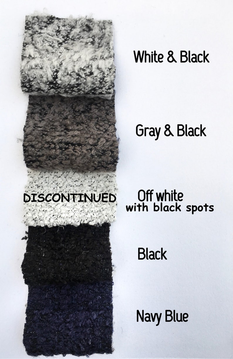 May include: Five fabric swatches in different colors and patterns. The swatches are labeled "White & Black", "Gray & Black", "Off white with black spots", "Black", and "Navy Blue". The swatch labeled "Off white with black spots" is marked "DISCONTINUED".