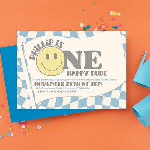 May include: A blue and white chequered birthday party invitation with a smiling face and the text "Phillip is One Happy Dude" and the date "November 27th at 2pm".