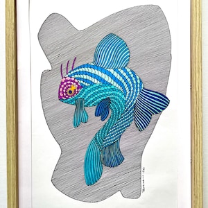 May include: A framed art print featuring a stylized fish illustration. The fish is rendered in shades of blue, turquoise, and purple, with intricate line work detailing its scales and fins. The artwork is set against a textured gray background.