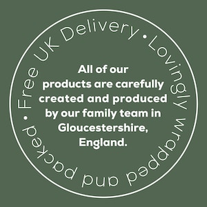 May include: A circular graphic on a green background with white text. The text reads "All of our products are carefully created and produced by our family team in Gloucestershire, England."