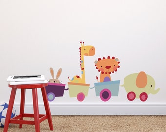 May include: A colorful wall decal featuring a train with animal passengers. The train is made up of four cars, each with a different animal: a rabbit, a giraffe, a lion, and an elephant. The animals are all smiling and have bright colors.