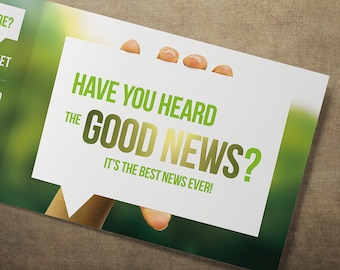 May include: A white speech bubble with green text that reads "Have you heard the good news? It's the best news ever!" The speech bubble is held by a hand with fingers visible.