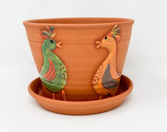 Bird planter with attached saucer