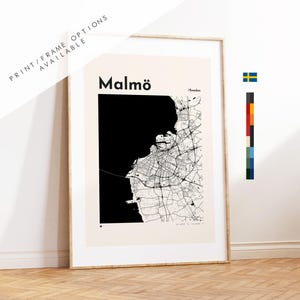 May include: Framed map print of Malmö, Sweden, in black and white. The city map is detailed, with a large black area representing the sea. The text "Malmö" is at the top, with "Sweden" below. Print/frame options available.
