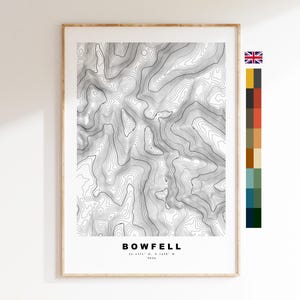 May include: A black and white topographic map print of Bowfell, a mountain in England. The map shows the elevation contours of the mountain. The print includes the name "Bowfell" and the coordinates "54.4476° N, 3.1438° W".