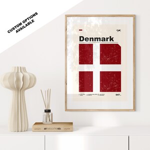May include: A minimalist poster with a distressed red and white Danish flag, the word "Denmark" in black text, and the number "047" in the bottom right corner.