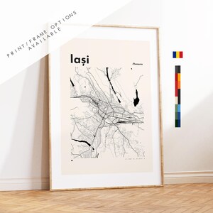 May include: A framed vertical wall art print featuring a black line map of Iași, Romania, on a light beige background. The text reads Iași and Romania. A small Romanian flag icon and a vertical colour palette strip are visible on the right side.