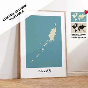 May include: A teal blue and beige minimalist map print of Palau, a country in Oceania. The print features the name "PALAU" and coordinates in white text. The print is framed in a light wood frame. The image also includes a world map with the location of Palau highlighted in red.