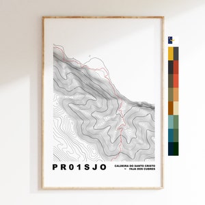 May include: A black and white topographic map of Caldeira do Santo Cristo in Faja dos Cubres, Azores, Portugal. The map shows contour lines and a red hiking trail. The text "PR01SJO" is in the lower left corner.