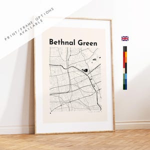 May include: Framed map print of Bethnal Green, London, featuring a detailed black and white street layout. The print includes the text "Bethnal Green" in bold black letters. The print is in a light-colored frame.