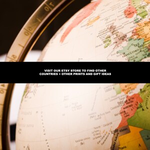May include: A vintage globe with a brown wooden stand. The globe is a light beige color with a map of the world printed on it. The map is in various colors, including red, green, yellow, and blue. The globe is tilted at an angle, and the text "VISIT OUR ETSY STORE TO FIND OTHER COUNTRIES + OTHER PRINTS AND GIFT IDEAS" is visible at the bottom of the image.