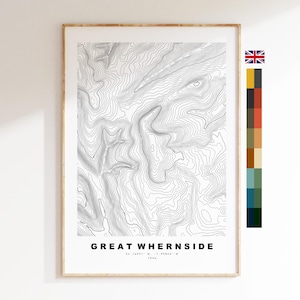 May include: Framed topographic map print of Great Whernside, featuring contour lines in black and white. The print includes the text "GREAT WHERNSIDE" and coordinates. The frame is a light wood color.