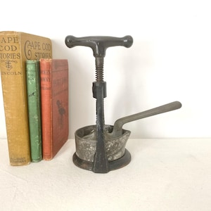 Antique Landers Frary & Clark Cast Iron Citrus Press