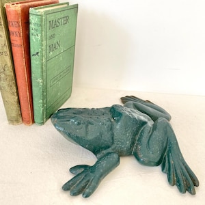 May include: A set of three ceramic mugs with a speckled, matte finish. The mugs are in shades of blue, green, and white. Each mug has a simple, modern design, perfect for coffee or tea.