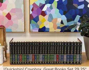 May include: A collection of thirty-one black hardcover books titled Great Books, each featuring gold lettering and numbering on the spine. The set is arranged in a single row, with the text Quickship Covobox, Great Books Set 29.25 inches visible.