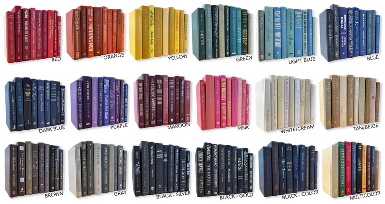 May include: A collection of decorative books stacked in rows, showcasing a variety of colors, including red, orange, yellow, green, light blue, blue, dark blue, purple, maroon, pink, white, tan, brown, gray, black, silver, gold, and multicolor.