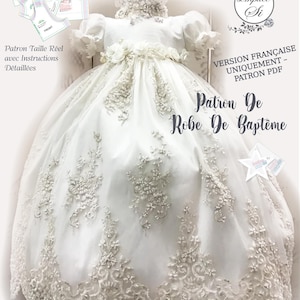 May include: A white baptism dress with intricate lace detailing and floral embellishments. The dress features a full skirt and short sleeves. Text on the image reads "Patron De Robe De Baptême" and "VERSION FRANÇAISE UNIQUEMENT - PATRON PDF".