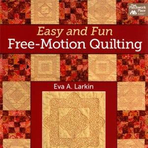 May include: A book cover with the title "Easy and Fun Free-Motion Quilting" in white text on a red banner. The cover features a quilt design with squares and floral patterns in shades of red, brown, and beige. The author's name, Eva A. Larkin, is also displayed.