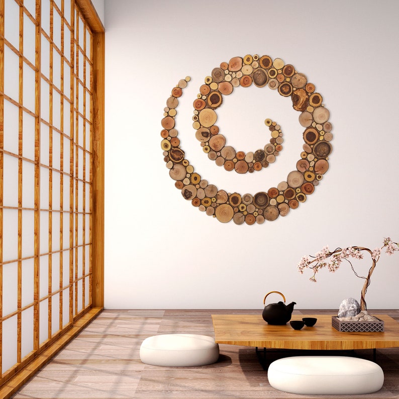 It is an artwork in the shape of a spiral placed on the wall in a zen environment. The spiral is made from slices of tree branches and has great beauty and personality due to the shape and shades of the slices. Sizes: 20, 24, 28, 32, 36, 40 in.