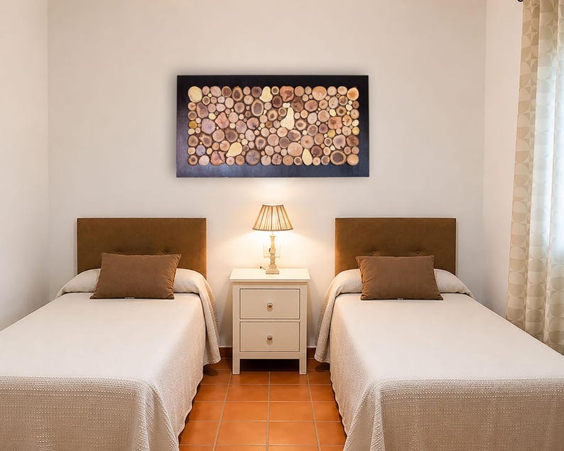 A room with two beds and a nightstand in the middle.
On the nightstand is a statement piece of art that takes center stage and catches your eye as soon as you enter the room.