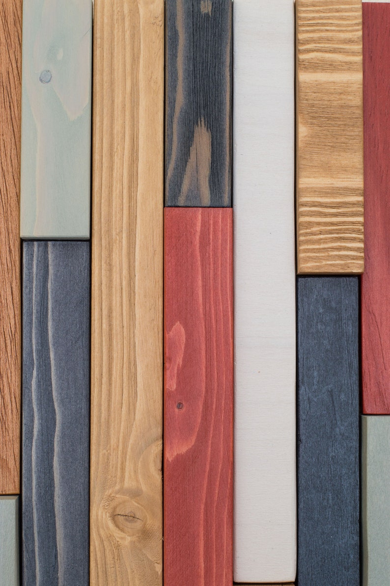 Detail image showing the colour and the beauty of the grain of the wood pieces that are part of this abstract painting on wood. The colours I have used are blue-grey, red, white, warm grey and oak.