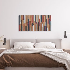 The image shows the work on the geometric wall hanging decor of a double bedroom.