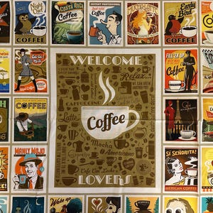 May include: A white ceramic mug with a black handle and the text "But First, Coffee" in a bold, black font. The mug is set against a blurred background, highlighting its clean design.