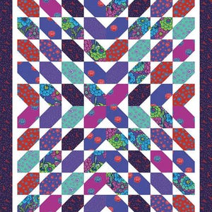 May include: A quilt pattern with a white background and a grid of colorful squares. The squares are arranged in a diagonal pattern, creating a geometric design. The colors include red, pink, purple, blue, and green.
