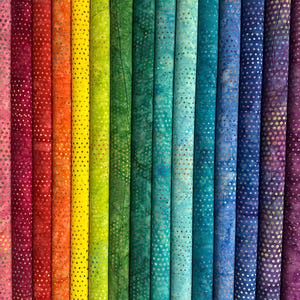 May include: A selection of fabric rolls in a rainbow of colours, from pink to purple, arranged vertically. Each roll has a dotted pattern in a metallic shade, creating a visually appealing display. The fabric appears to be cotton or a similar material, suitable for various craft projects.