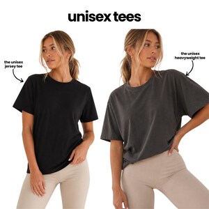 The image is a collage of two photos featuring a woman wearing a black t-shirt and a gray t-shirt, with text indicating the differences between the two styles of t-shirts.
