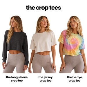 The image is a collage of three different crop tops, each with a distinct color and style, labeled as the long sleeve crop tee, the jersey crop tee, and the tie dye crop tee.