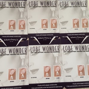 May include: Three packages of earlobe support patches for earrings. Each package has a purple background with the text "LOBE WONDER" and "EAR LOBE SUPPORT PATCHES FOR EARRINGS". The packages show a before and after image of an earlobe with an earring.