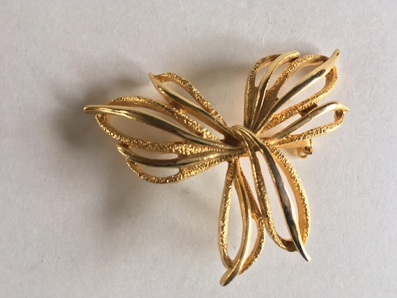 Textured and Polished Gold Tone Intertwined Wings… - image 1