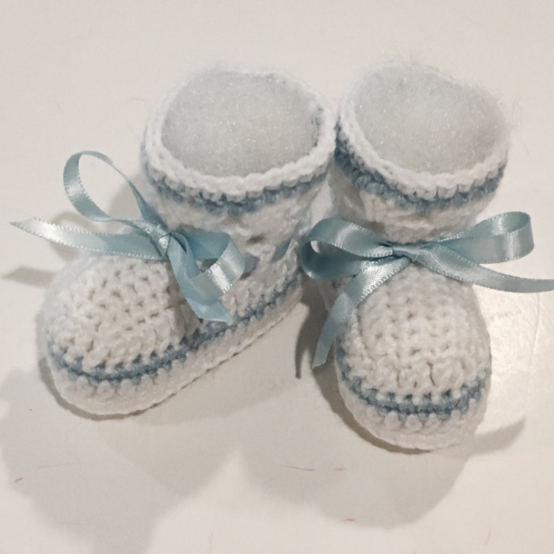 white newborn booties