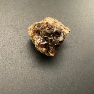 Garnet and Spessartine raw in matrix from New Mexico