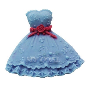 May include: A blue dress cake mould with a red bow and floral details. The mould is made of silicone and is designed to create a cake that looks like a dress.