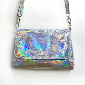 Holographic Silver Messenger bag, magnet flap close, Lining options, zipper pockets, premium Italian holo leather, removable adjust. strap