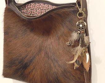 Natural cowhide Leather Crossbody Bag, Soft leather, hair on leather front of bag, pockets, zipper closure, leather charm, 2 sizes