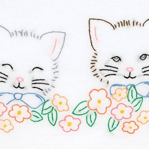 May include: Embroidered design featuring two white cat faces with blue bow ties and pink noses. The cats are surrounded by a garland of orange and pink flowers with green leaves, all on a white background.