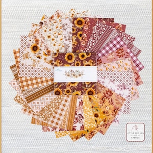 May include: A stack of square fabric swatches arranged in a circular fan pattern. The fabric features various autumn-themed prints including sunflowers, plaid, gingham, and floral patterns in shades of orange, brown, cream, and maroon. A white paper band with the text Little Red Hen Fabrics wraps around the center.