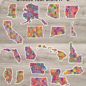 May include: A collection of die-cut stickers shaped like various U.S. states, each featuring a vibrant, multi-colored geometric quilt pattern. The text 'Choose Your State A - L' is displayed at the top of the arrangement of these colorful state-shaped decals.