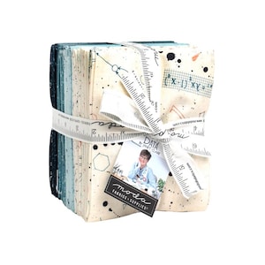 May include: A stack of folded fabric squares tied with a white ribbon printed with a ruler design. The fabric features scientific and mathematical patterns in shades of cream, blue, and black. A tag attached to the ribbon shows a person and the text Data by Janet Clare and Moda Fabrics Supplies.