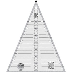 May include: A clear, triangular quilting ruler with measurements in inches. The ruler features a Spider Web design by Karla Alexander, with markings from 1 to 10 inches. It includes a QR code and the Creative Grids logo.