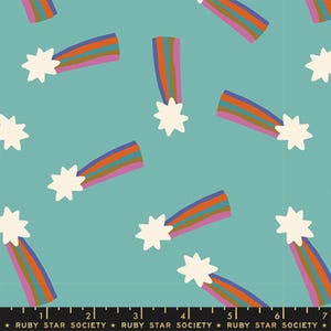 May include: A teal fabric with a repeating pattern of colorful rainbows and white starbursts. The rainbows have orange, purple, and brown stripes. The text "RUBY STAR SOCIETY" is at the bottom.