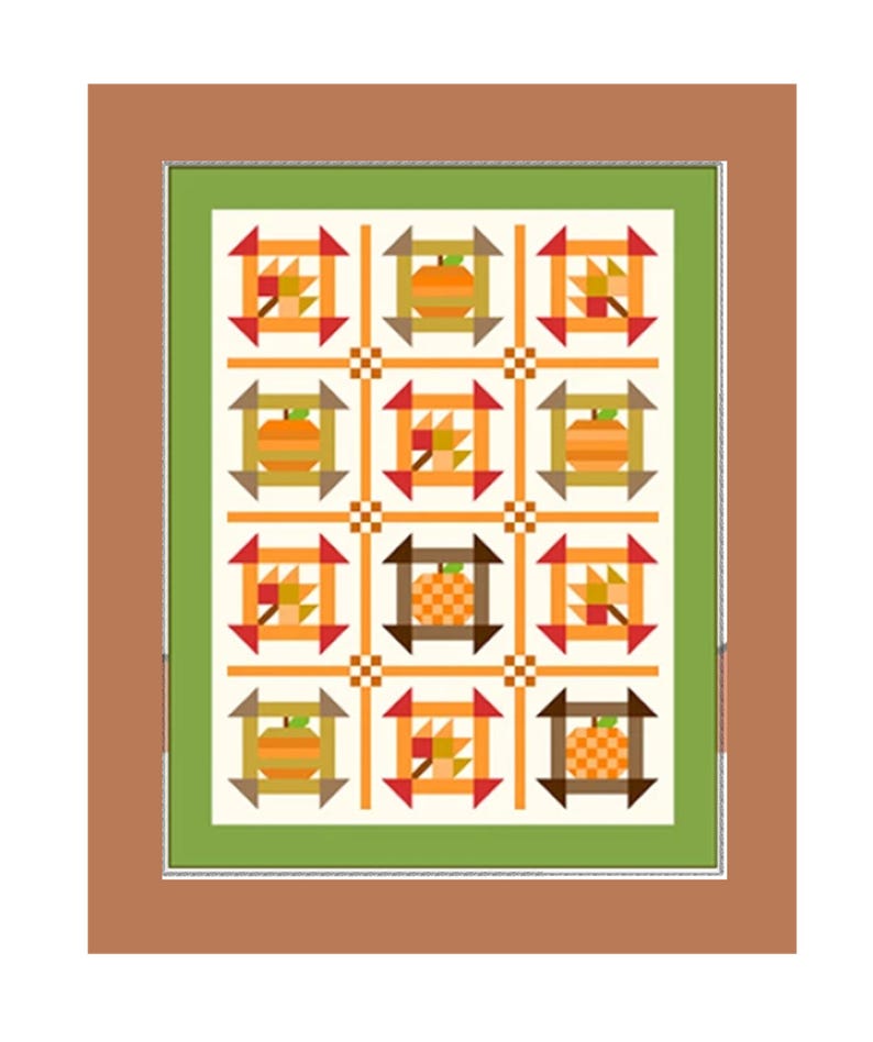 Puede incluir: Un edred&oacute;n enmarcado con un patr&oacute;n repetido de calabazas y hojas de oto&ntilde;o. Los bloques del edred&oacute;n son en tonos de naranja, marr&oacute;n y verde, sobre un fondo crema. El marco es de color marr&oacute;n c&aacute;lido.